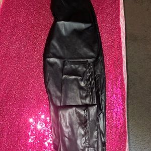 Faux Leather Black Pants with small slits on the ends.
